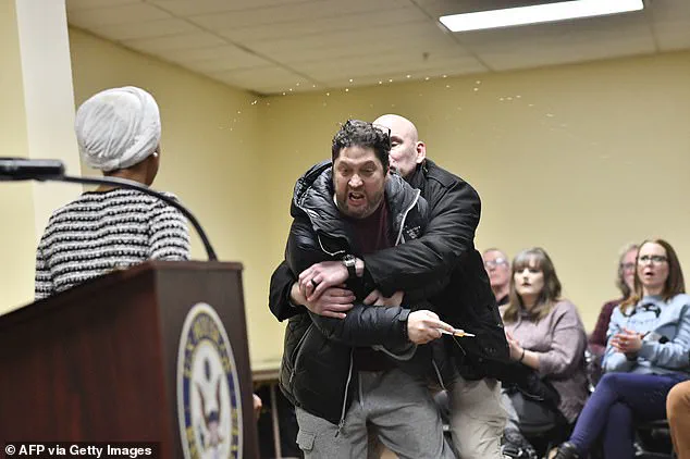 Minneapolis Town Hall Meeting Disrupted by Suspect Spraying Congresswoman Ilhan Omar with Vinegar-Like Liquid, Leading to Assault Charges